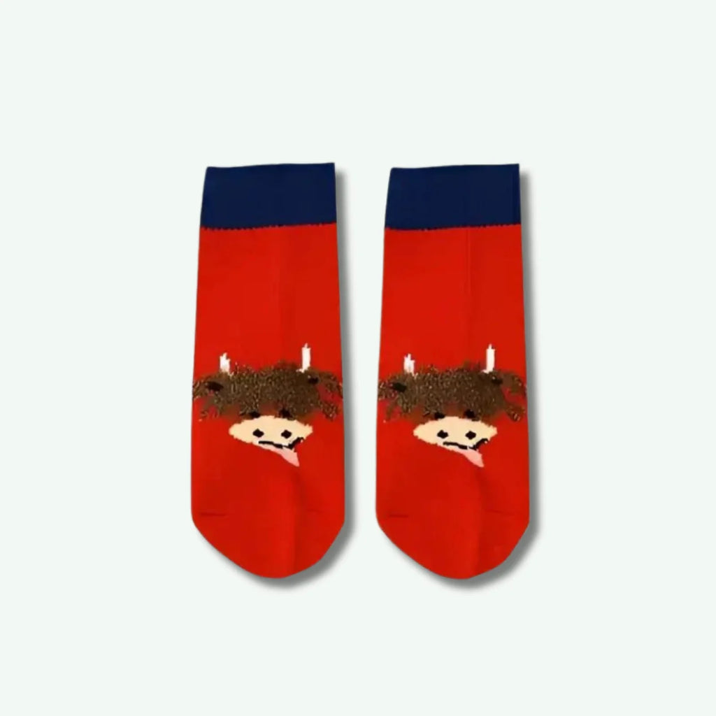 Red socks with cartoon character design on a white background