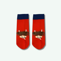 Red socks with cartoon character design on a white background