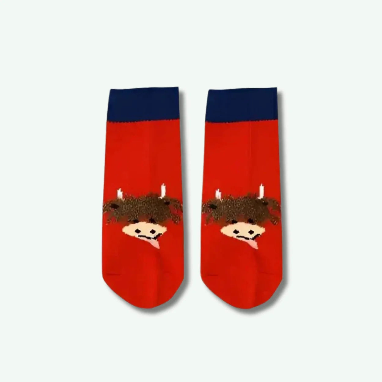 Red socks with cartoon character design on a white background