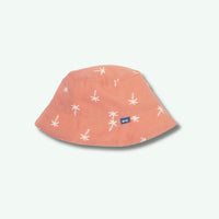 Pink bucket hat with white starfish pattern on a light gray background