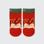 A pair of red knit ankle socks with a green ribbed cuff, featuring a cute cartoon hedgehog design on the front.