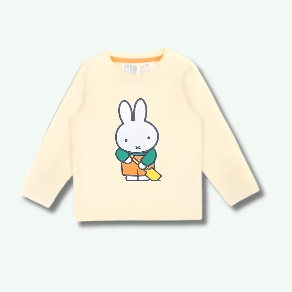 Beige long-sleeve shirt with a cartoon character on a white background