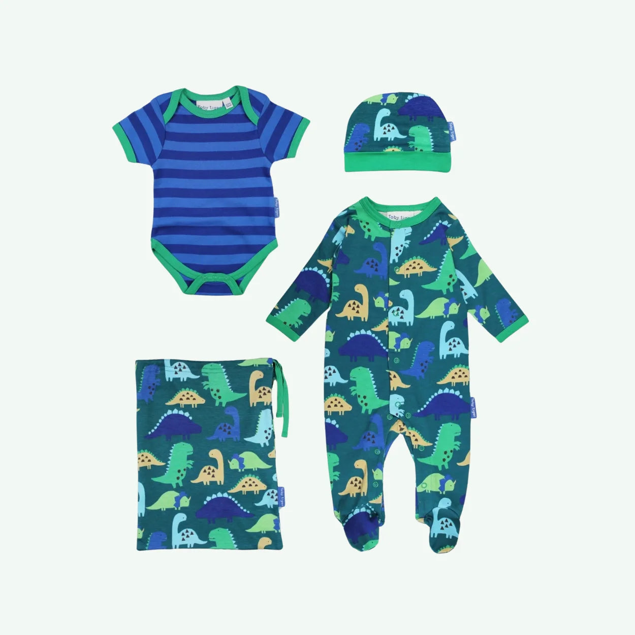 Baby clothing set with striped onesie, dinosaur-patterned romper, hat, and blanket on a white background