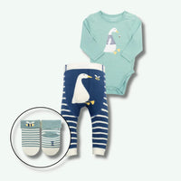 Children's outfit set with a light blue long-sleeve shirt and navy pants with duck design, accompanied by socks.