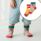 Child wearing colorful striped socks with a close-up inset of the socks.