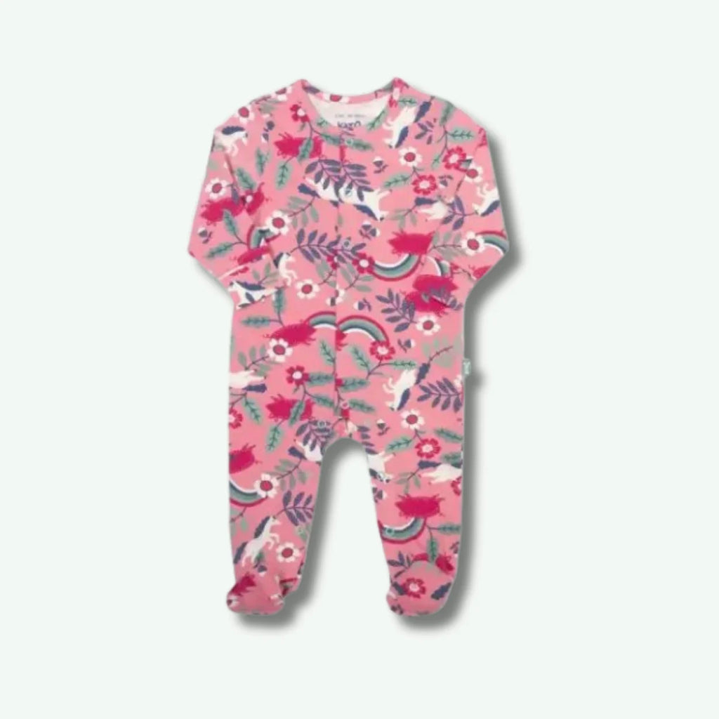 Pink baby onesie with floral and rainbow pattern on a white background