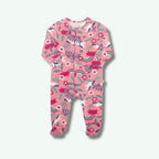 Pink baby onesie with floral and rainbow pattern on a white background