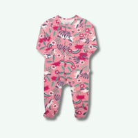 Pink baby onesie with floral and rainbow pattern on a white background