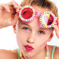 Girl wearing Bling2o Pool Jewels Candy Bracelet Swim Goggles with heart-printed lenses on her forehead