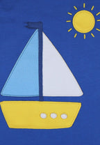 Sailboat design on a blue background with a yellow sun