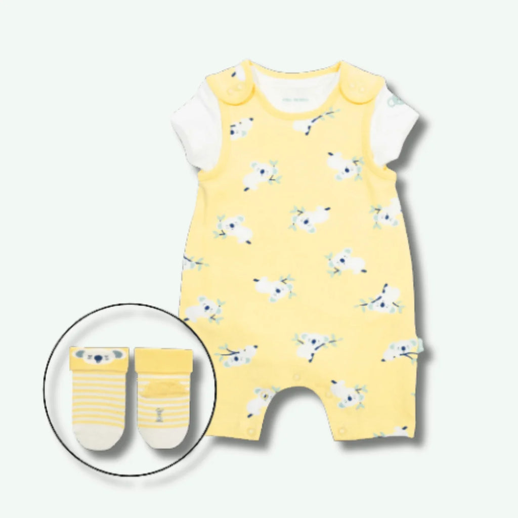 Yellow romper with bird pattern and matching socks on a white background